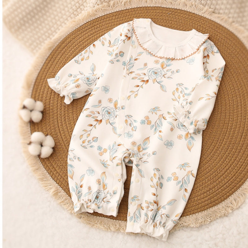 Baby one-piece romper white flower one the floor